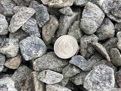 Our grey crushed stone is another sharp stone alternative. It compacts and is better for foundation drip edges. It is not a washed product but works well for most drainage applications.  